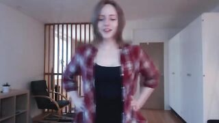 Babe caresses her huge cock, moaning as she masturbates with her sexy legs shivering