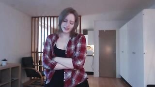 Babe caresses her huge cock, moaning as she masturbates with her sexy legs shivering