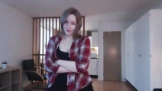 Babe caresses her huge cock, moaning as she masturbates with her sexy legs shivering