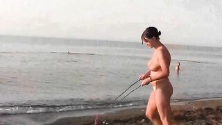 Nudist beauties have fun on the sandy beach