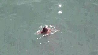 A couple enjoy each other without clothes on at sea