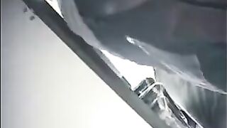 The employee secretly shoots chicks at the checkout, lifting their skirts