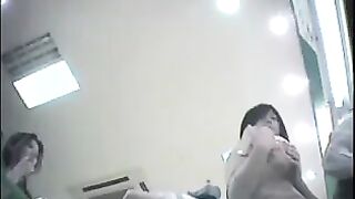 The employee secretly shoots chicks at the checkout, lifting their skirts