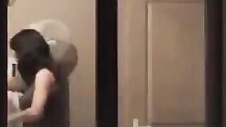 He admires himself in the mirror, standing in front of it completely naked
