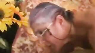 An adult man fucked a gray-haired woman in black stockings, she moaned with pleasure