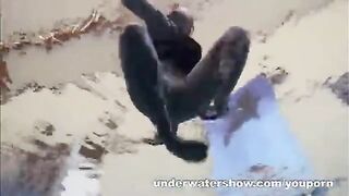 A sexy girl is floating naked in the pool, creating a sensual video
