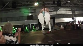 A hot brunette learns to work with a strip pole in this steamy scene