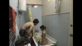 A girl is having sex with her brother in the bathroom