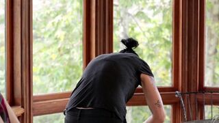 A cute Vietnamese girl was fucked in the kitchen by a horny bisexual with a strap-on