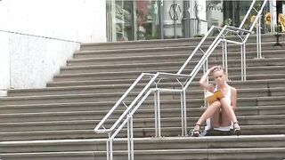 A girl is walking without panties on the city streets