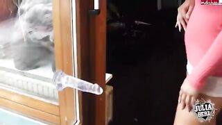 A cute brunette with big tits plays with a dump truck toy