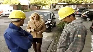 A girl in black pantyhose makes a blowjob directly on the porn set