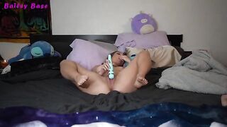 The sexy girl plays with her feet and gets a great pleasure