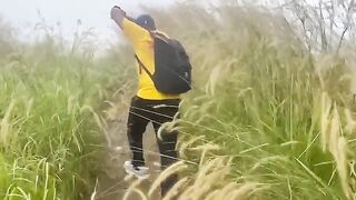 A daring couple engaged in risky public sex on a mountain
