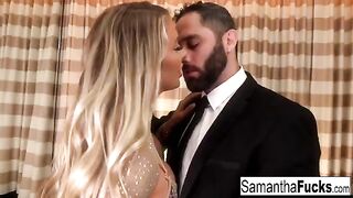 A busty blonde is having fun in the hotel room, showcasing her charm