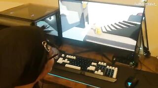 A couple has a fun challenge while playing video games and kissing