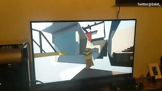 A couple has a fun challenge while playing video games and kissing