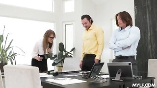A woman with glasses has sex with two guys in stockings and pantyhose