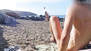 Two girls almost got caught jerking off with a stranger on the nude beach