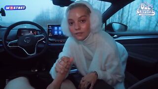 A beautiful girl is having fun with stranger in his car