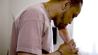 A cute blonde is being licked by a black man