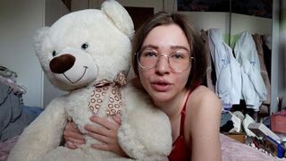 A young, pretty girl has a teddy bear as her best friend