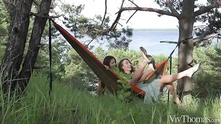 A sunbathing babe gets a surprise from her lesbian lover in nature