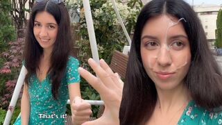 A girl has sex and she gets a cumshot on her face in public