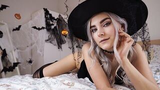 A cute witch in a purple dress waits for her lover to fuck her