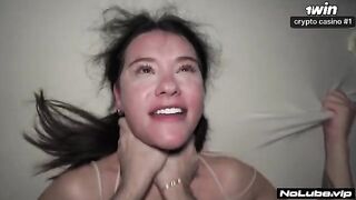 A woman squirts a lot of liquid on her man, soaking him completely