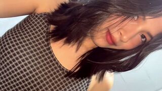 This petite Asian is ready to get completely naked for you