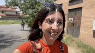 A crazy girl is doing blowjob on the city streets and gets a cumshot