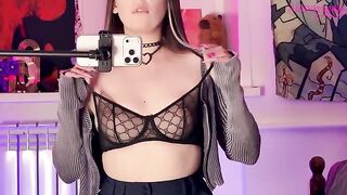 A girl caressed herself with a mirror, embodying alternative allure