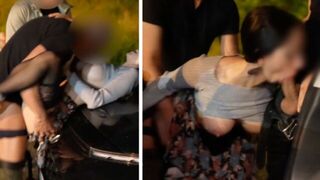 A girl is having fun with three guys at the same time in the car