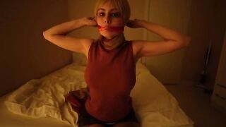 A girl dressed as a resident plays with her favorite toy in an intense scene