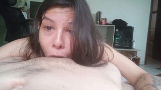 A woman swallows the dick of her guy in her throat
