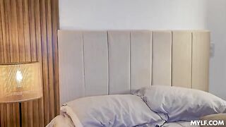 A shameless blonde has fun with a man with tattoos on the bed