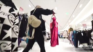 Naughty girl caressed cock in the fitting room and almost got caught