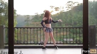 A cute Asian girl, Jasmine J, gets fucked by a sex machine on the balcony